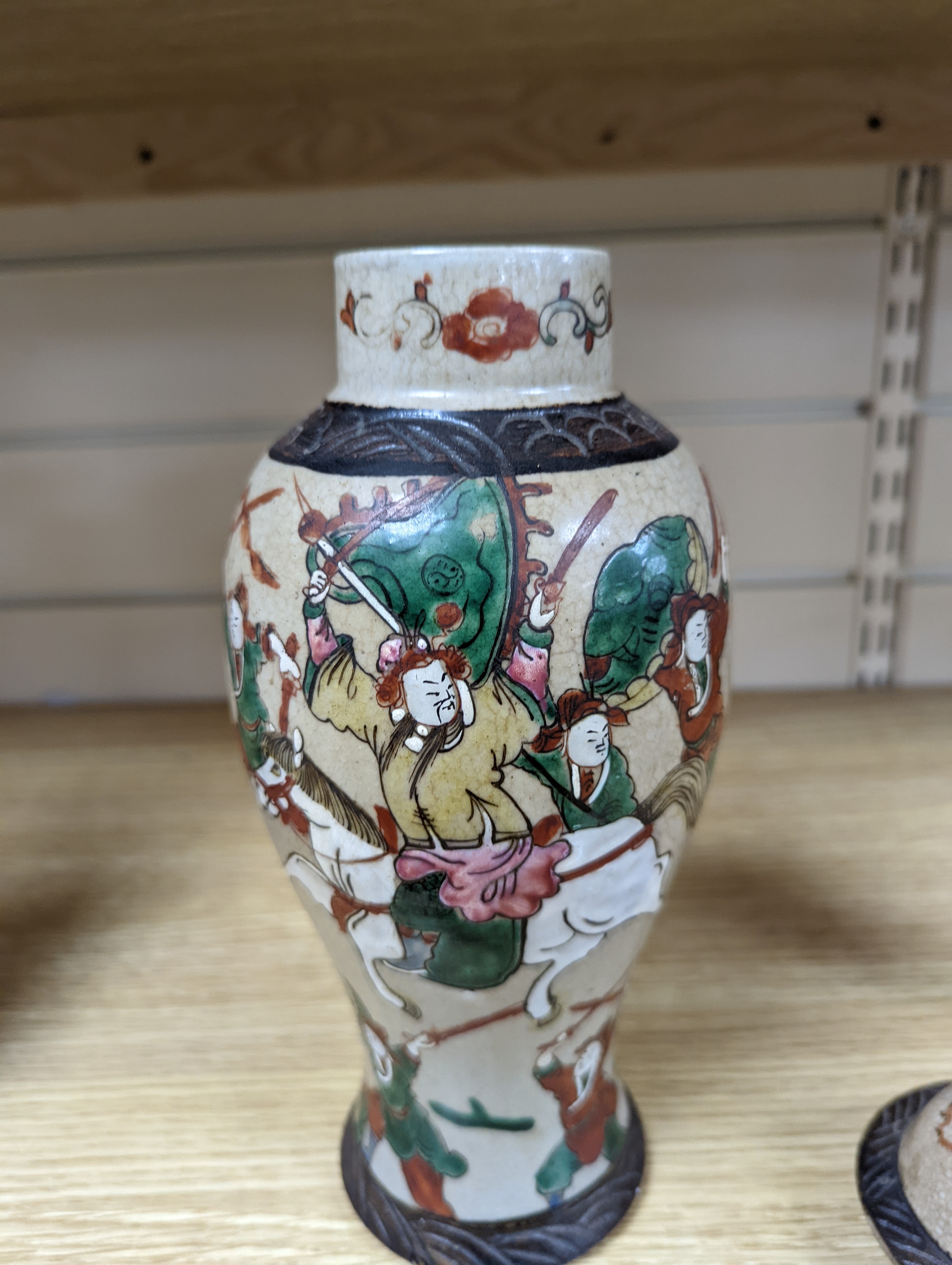 A late 19th century Chinese crackle glaze famille rose baluster vase and cover 30cm